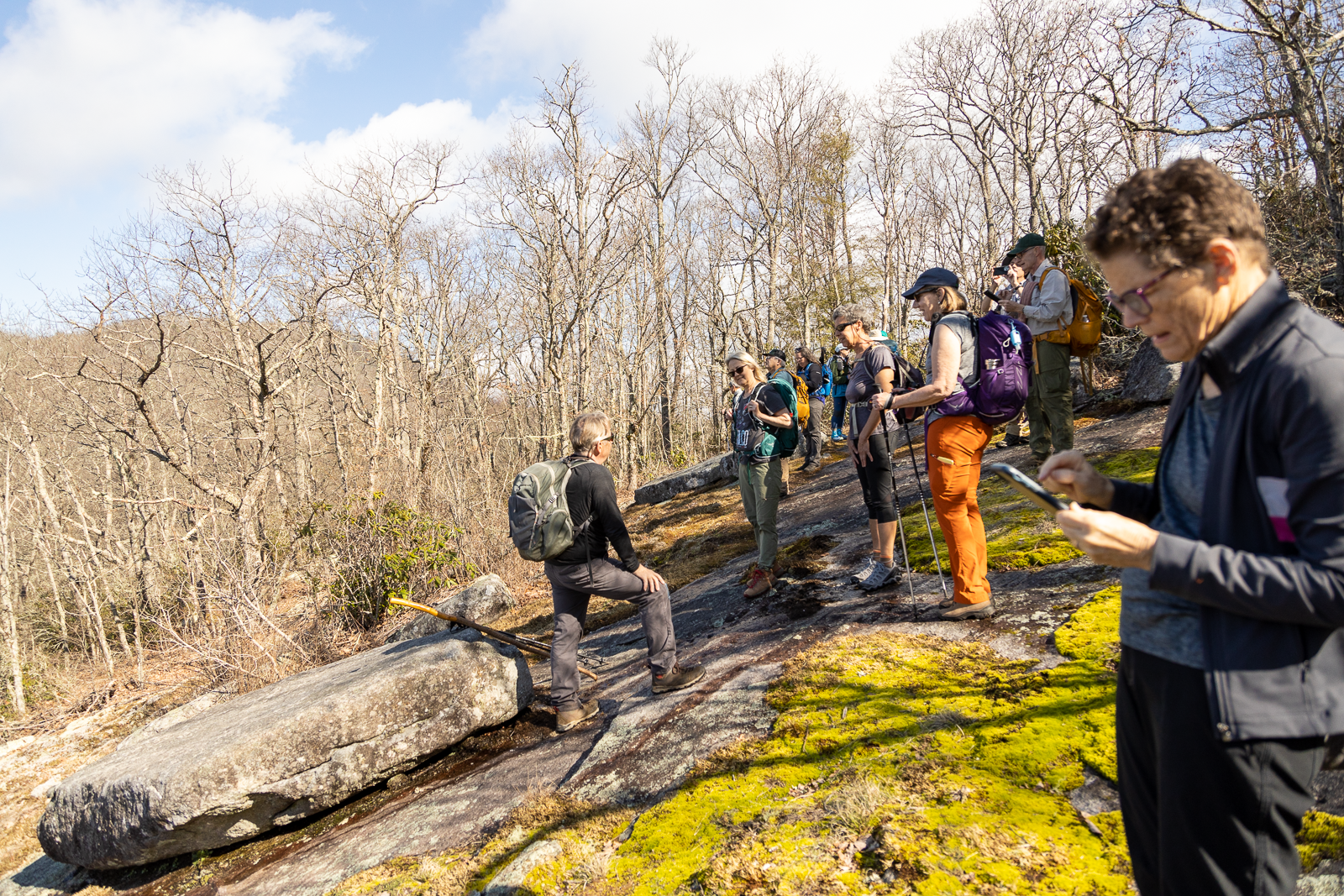 Hikers stopping to take in a view of Whiterock on the Bartram Trail between Jones Gap and Hickory Knoll Road